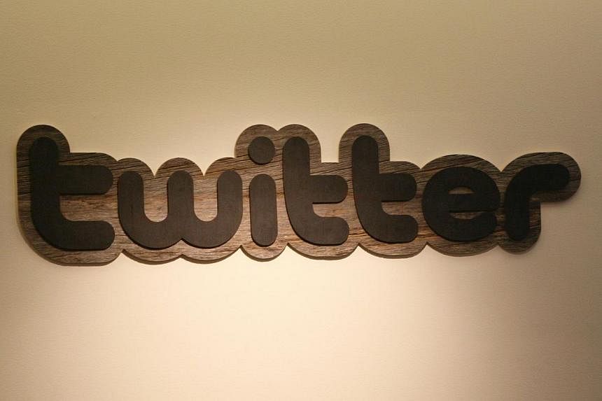 Twitter logo displayed at the entrance of Twitter headquarters in San Francisco, California. -- PHOTO: AFP