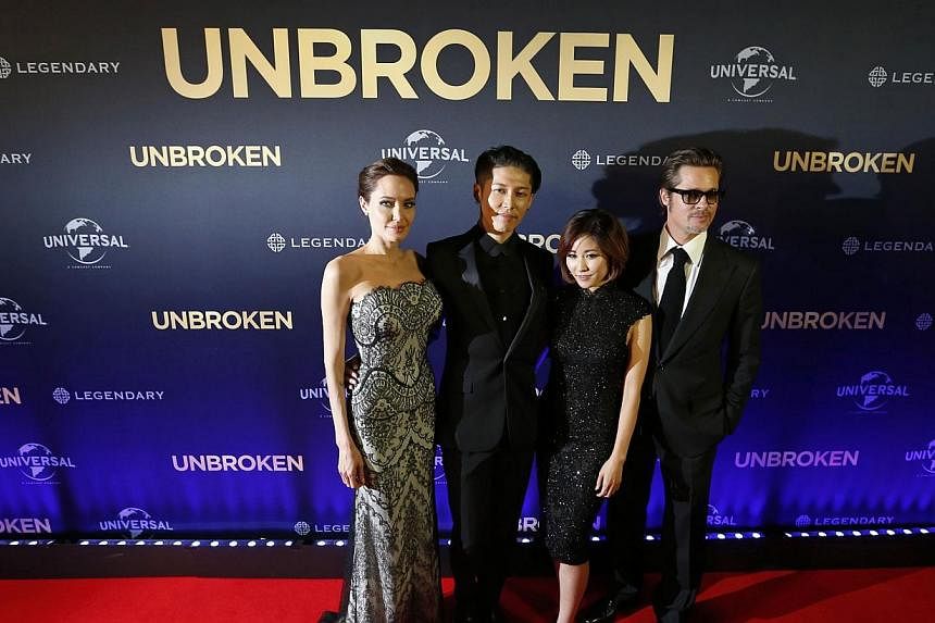 (From left) Angelina Jolie, cast member Miyavi, his wife Melody Ishihara and Brad Pitt pose at the world premiere of Jolie's film Unbroken at the State Theatre in Sydney on Nov 17, 2014. -- PHOTO: REUTERS