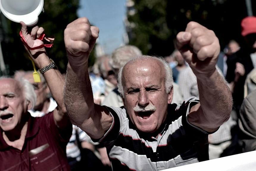 Pensioners demonstrate on Oct 2, 2014 in the centre of Athens against the Greek government's economic measures. -- PHOTO: AFP