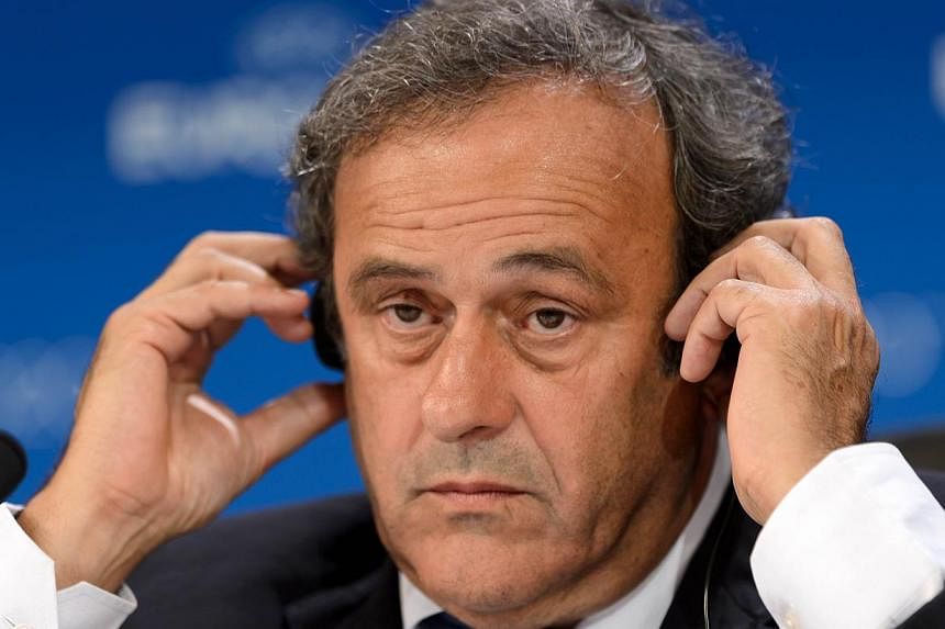 Uefa president Michel Platini has called on American investigator Michael Garcia's report into the bidding which led to the controversial awarding of the 2018 and 2022 World Cups to Russia and Qatar to be made public. -- PHOTO: AFP