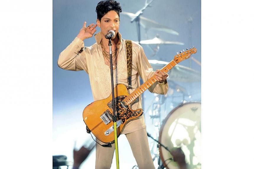 This file picture dated July 1, 2011 shows US singer Prince performing on the main stage during The Hop Farm music festival, in Paddock Wood, Kent. -- PHOTO: AFP