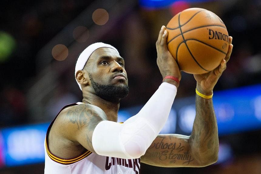 LeBron James of the Cleveland Cavaliers shoots a free-throw as his team crushed the Orlando Magic 106-74 last night before he weighed in on social media about&nbsp;a grand jury&nbsp;decision not to prosecute a white policeman for shooting and killing