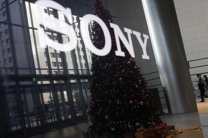 The logo of Sony Corp and a Christmas tree are reflected on the company's 4K television set at the company's headquarters in Tokyo Nov 18, 2014. &nbsp;Its entertainment division said its computer system was down for a second day on Tuesday, following