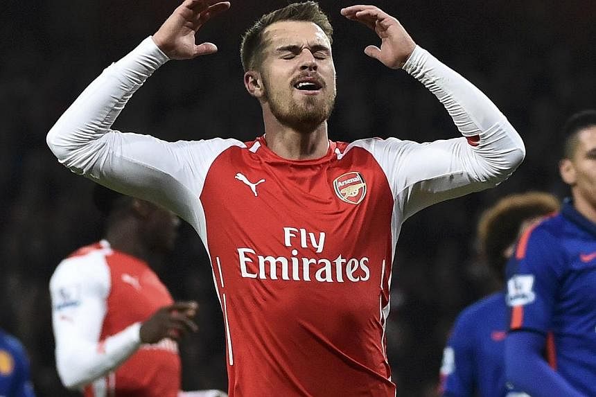 Arsenal's Aaron Ramsey reacts to a missed opportunity during their English Premier League football match against Manchester United at the Emirates Stadium in London on Nov 22, 2014. -- PHOTO: REUTERS