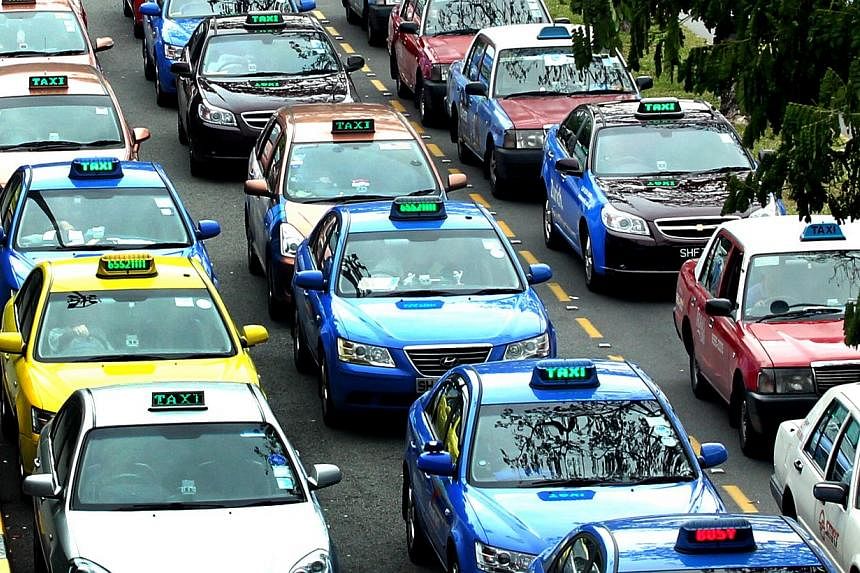 At least 85 per cent of taxi operators' fleets will have to meet a daily minimum mileage of 250km on weekdays, and during the peak periods, 85 per cent of their taxis must also be on the roads. -- ST PHOTO: CHEW SENG KIM