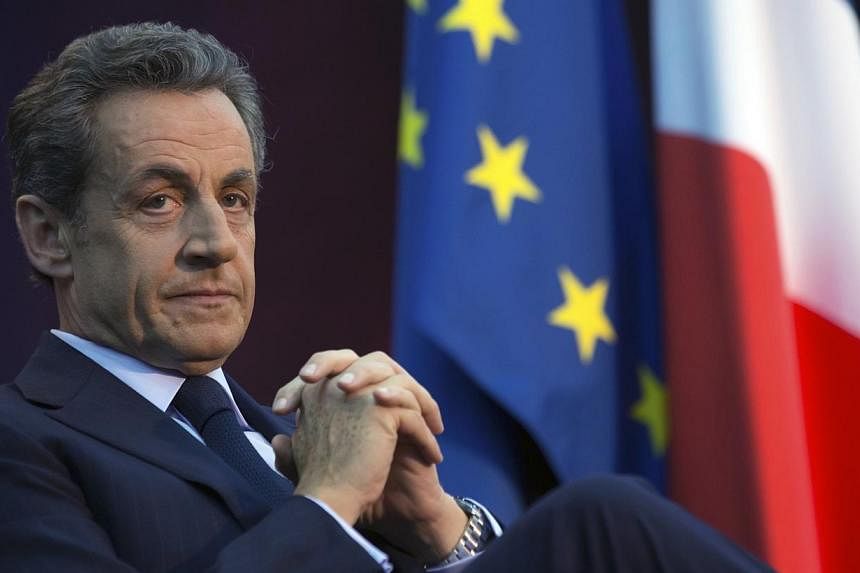Former French President Nicolas Sarkozy attends a political rally as he campaigns for the leadership of the UMP political party in Boulogne-Billancourt, Paris suburb, on Nov 25, 2014. France's ex-president is limbering up for his potential springboar