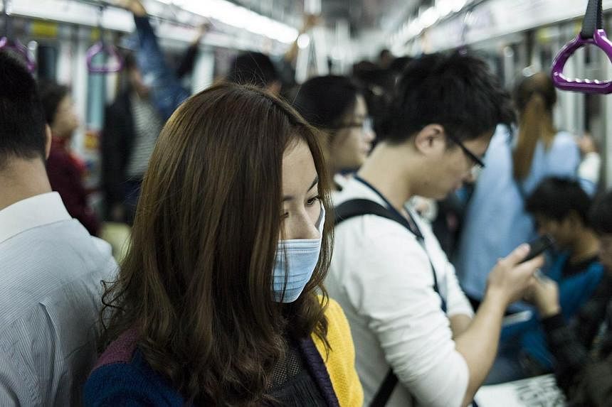 Beijing will raise subway and bus fares in December as part of a drive to reduce price subsidies and curb congestion on the public transport system in the Chinese capital. -- PHOTO: AFP