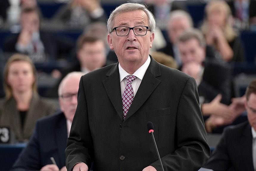 EU Commission chief Jean-Claude Juncker (centre) speaks to unveil an eagerly awaited 315-billion-euro investment plan to "kickstart" the economy, on Nov 26, 2014, at the European Parliament in Strasbourg, eastern France.&nbsp;European Commission Pres