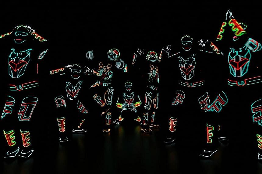 Light Balance, Britain's Got Talent (2014) semi-finalists, performs for shoppers at the basement atrium of Parkway Parade as part of the mall's line up of Christmas events and activities. -- ST PHOTO: NEO XIAOBIN