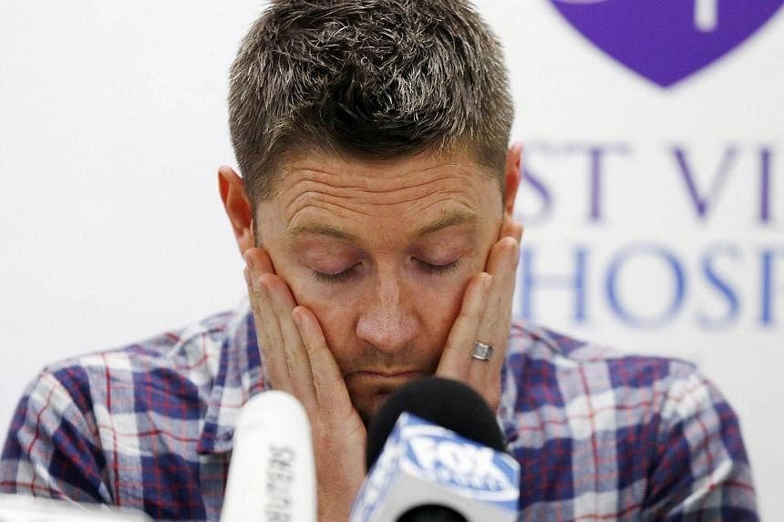 Australian cricket captain Michael Clarke pauses before delivering a statement, on behalf of the family of deceased teammate Phillip Hughes, at St Vincent's Hospital in Sydney on Nov 27, 2014. -- PHOTO: REUTERS