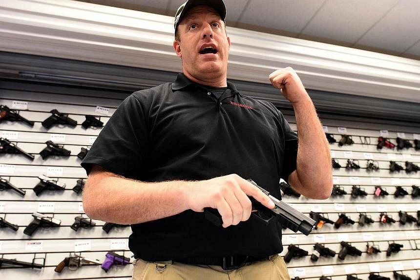 Paul Bastean, owner of the Ultimate Defence Firing Range and Training Centre in St Peters, Missouri, some 32km west of Ferguson, speaks to a journalist on Nov 26, 2014. -- PHOTO: AFP
