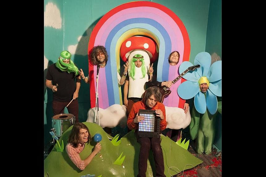 The Flaming Lips with their bizarre props and trippy colours (clockwise from top left) Nicholas Ley, Wayne Coyne, Matt Duckworth, Derek Brown, Michael Ivins, Steven Drozd and Jake Ingalls. -- PHOTO: GEORGE SALISBURY