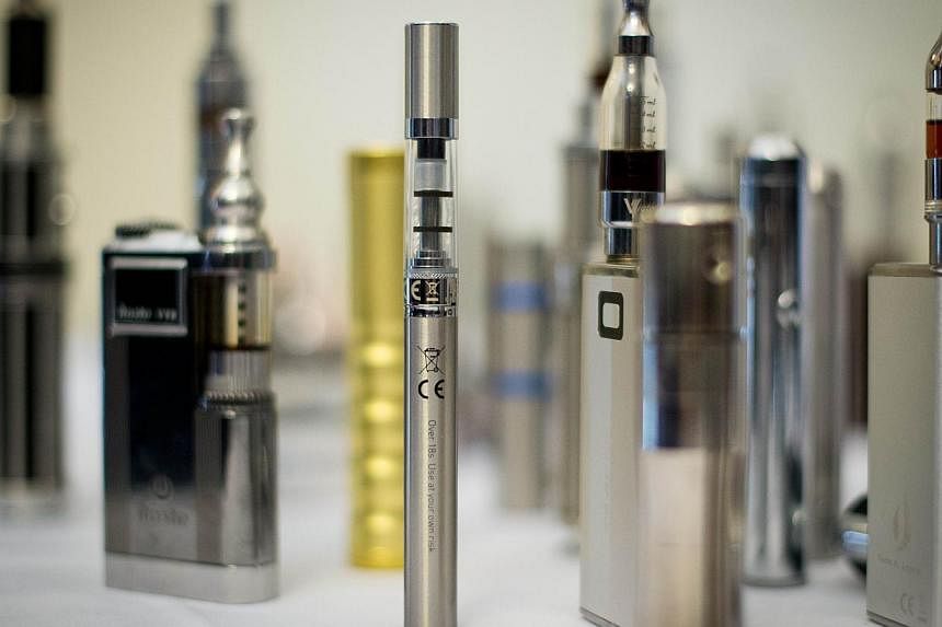 A selection of nicotine containing products (NCPs) during The E-Cigarette Summit in London. -- PHOTO: AFP
