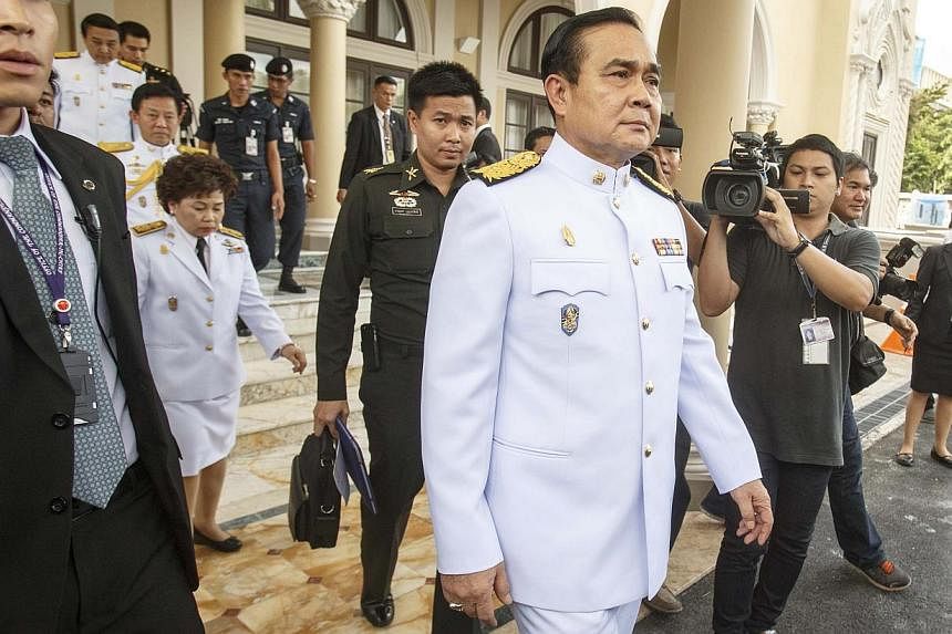 Thailand's Prime Minister Prayuth Chan-ocha leaves Government House as he leads a new cabinet to an audience with King Bhumibol Adulyadej at Siriraj Hospital in Bangkok on Sept 4, 2014. -- PHOTO: REUTERS