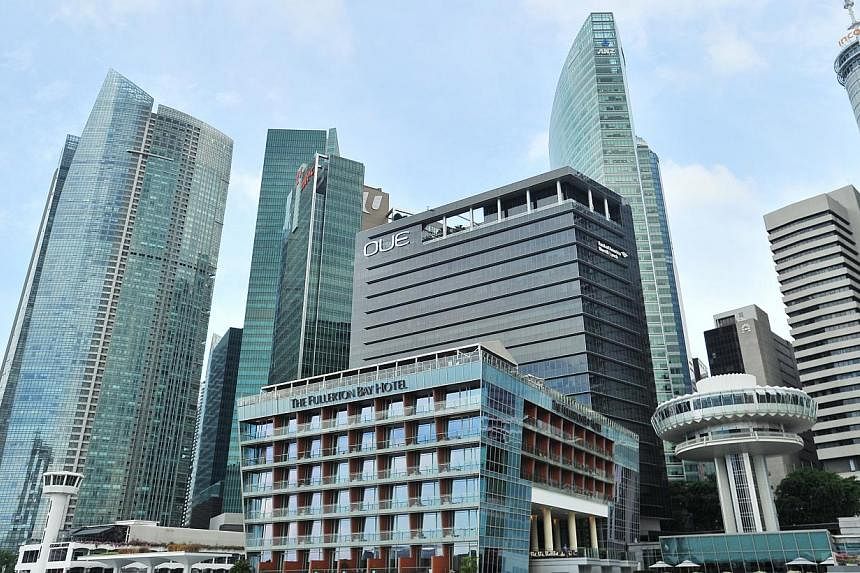 Rents for prime and Grade A spaces in Singapore's core commercial districts rose at an average of 1.6 per cent in the last quarter of 2014. -- ST PHOTO: LIM YAOHUI