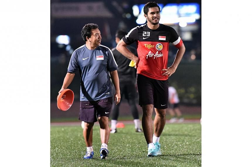 FAS kitman Omar Mohamed (left) with Zulfahmi Arifin at the national football team's centralized training session ahead of the Suzuki Cup, Nov 12, 2014. -- ST PHOTO:&nbsp;LIM YAOHUI