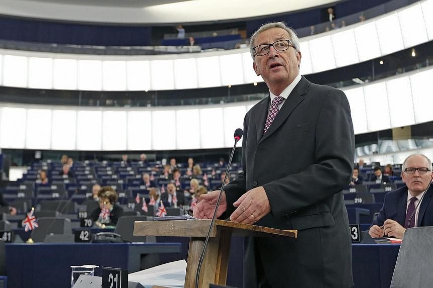 Commission President Jean-Claude Juncker said no final decisions on sanctions would be taken until March in order for governments to come up with concrete measures and clear timetables. -- PHOTO: REUTERS