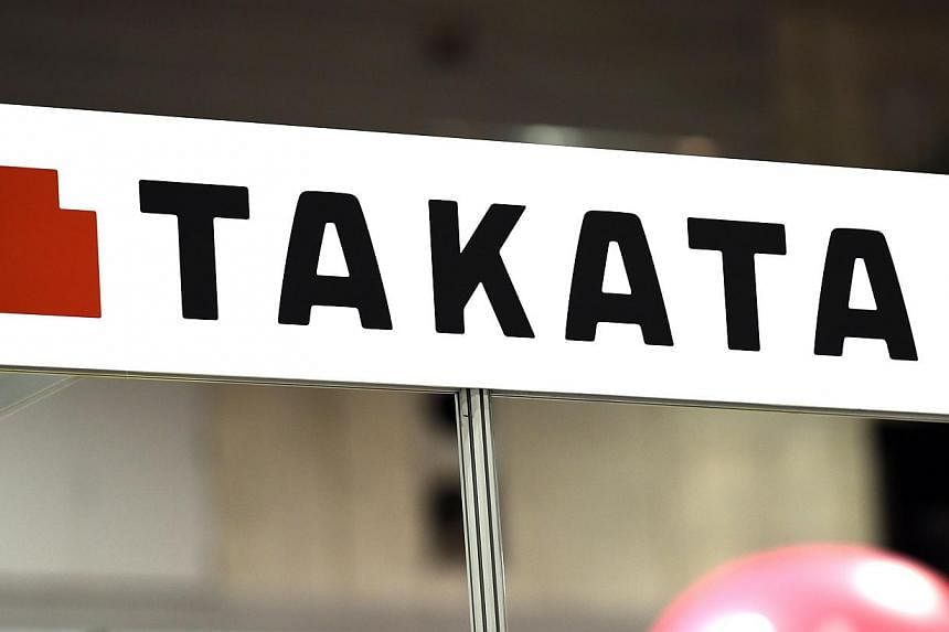 Takata's logo being displayed at an event in Yokohama, Japan. Toyota said on Nov 27, 2014, it is expanding a recall of cars with airbags made by auto parts maker Takata which have been linked to driver deaths. -- PHOTO: AFP