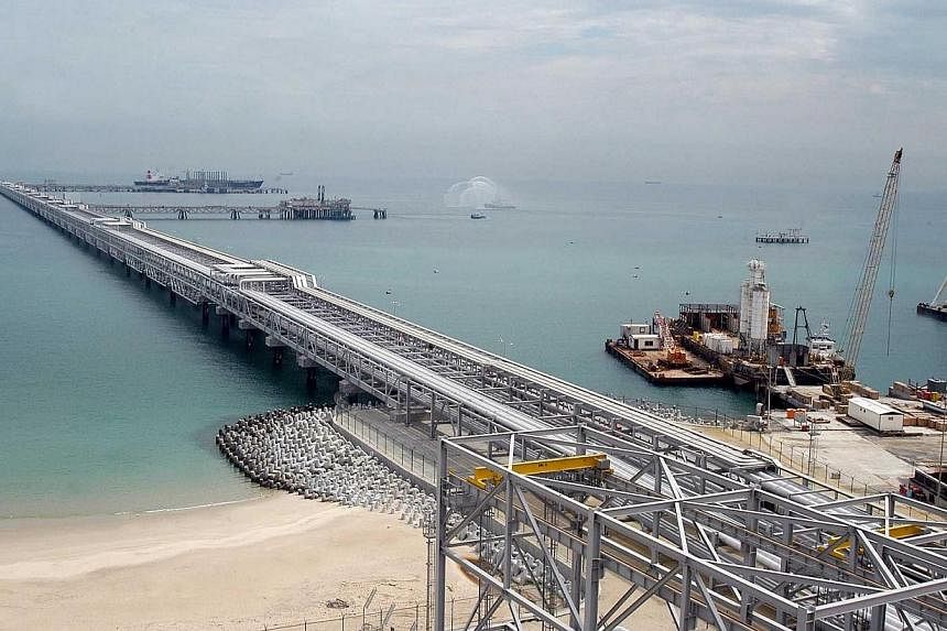 A file picture shows the pier at Kuwait's largest refinery of Al-Ahmadi, 30 kms from Kuwait City. Opec's decided not to cut oil output to support prices because of fear of losing market share, Kuwait's oil minister has said.--PHOTO: AFP