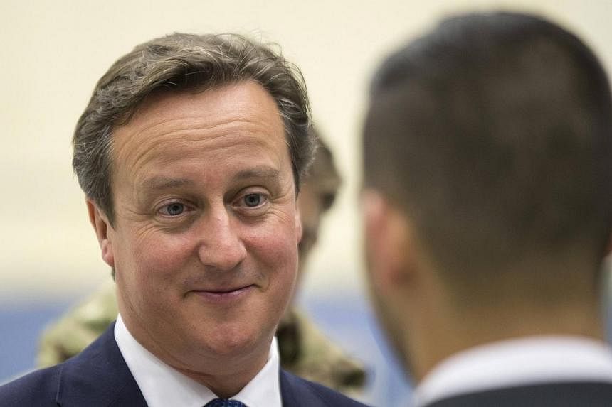 British PM David Cameron is set to announce a ban on EU migrants claiming welfare for four years. -- PHOTO: REUTERS &nbsp;