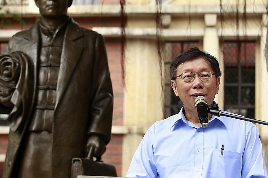 Taipei mayoral candidate Ko Wen-je gives a speech ahead of the local election in a park in Taipei on Nov 27, 2014.&nbsp;Dr Ko Wen-je, a top doctor who is leading the race to be Taiwan's next mayor, speaks to The Straits Times' Li Xueying on the city'