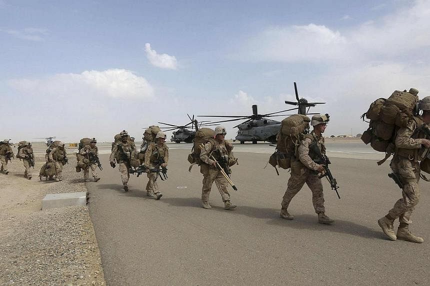 US Marines prepare to depart upon the end of operations for Marines and British combat troops in Helmand on Oct 27, 2014.&nbsp;Taleban insurgents have launched a prolonged attack on a major Afghan army base that was handed over by NATO forces last mo