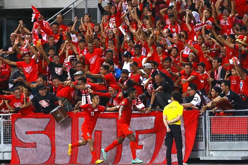 Singapore fans go wild after Singapore's Harris Harun scored at the AFF Suzuki Cup Group B match between Singapore and Myanmar at the National Stadium on Nov 26, 2014.&nbsp;Eighty-five per cent of Saturday's clash between Singapore and Malaysia have 