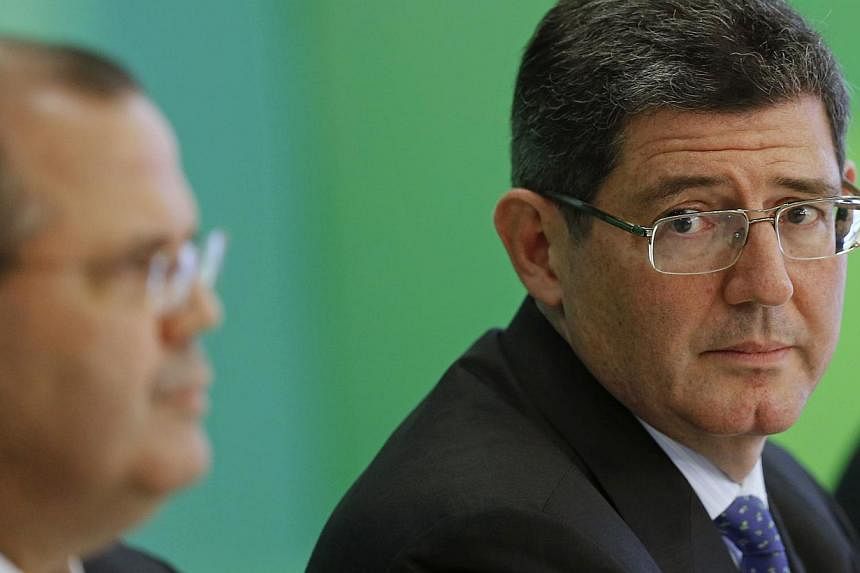 Brazil's incoming finance minister, banker Joaquim Levy, attends a news conference announcing the Brazilian government's new economic team, at the Planalto Palace in Brasilia Nov 27, 2014. -- PHOTO: REUTERS