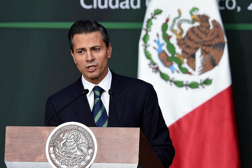 Mexican President Enrique Pena Nieto talks during his message about the new programme against corruption and new order in the police at the Palacio Nacional in Mexico City, on Nov 27, 2014. -- PHOTO: AFP