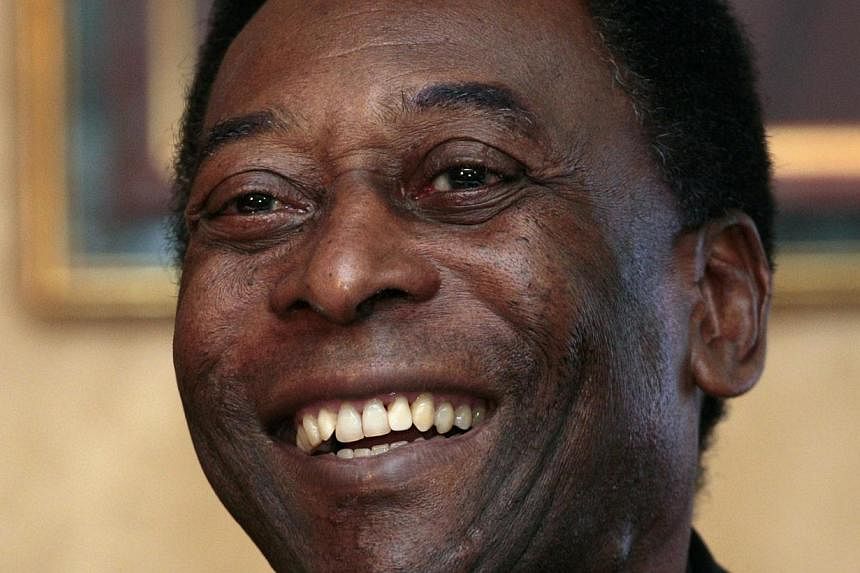 Brazilian soccer legend Pele smiles during a news conference in Hong Kong in this March 7, 2011 file photo. The football great&nbsp;was on Thursday taken into a special care unit in a Sao Paulo hospital after his health worsened, three days after bei