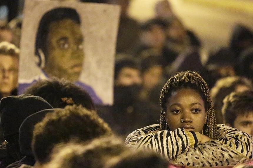 Demonstrators mark a moment of silence following the grand jury decision in the Ferguson, Missouri shooting of Michael Brown, in Seattle, Washington Nov 24, 2014.&nbsp;A UN watchdog on Friday slammed police shootings of blacks in the United States, d