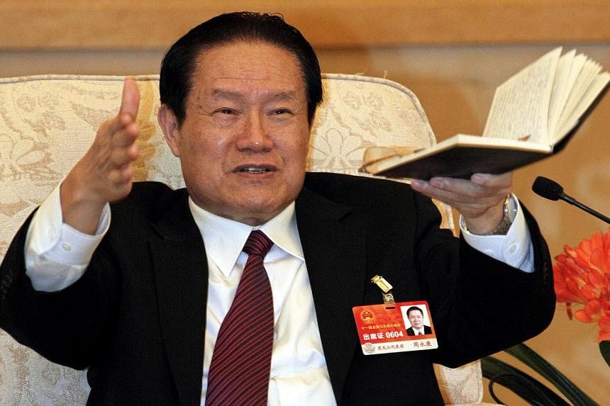 An investigation into China's former domestic security chief Zhou Yongkang (above, in a 2011 file photo)&nbsp;is probing five different networks, the newspaper of the ruling Communist Party said on Friday, naming senior figures it said may have benef