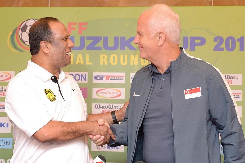 Malaysia coach Dollah Salleh (left) and Singapore coach Bernd Stange at Suzuki Cup press conference, Nov 28, 2014. -- ST PHOTO:&nbsp;LIM SIN THAI