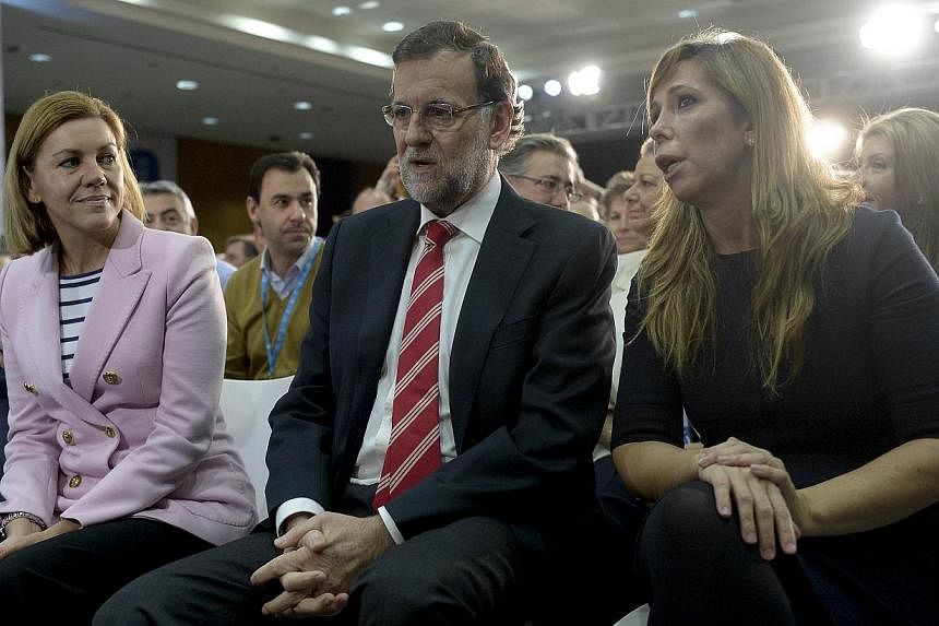 Spanish Prime Minister and Popular Party (PP) leader Mariano Rajoy (centre), PP general secretary Maria Dolores de Cospedal (left) and PP in Catalonia president Alicia Sanchez Camacho attend a conference of the PP on political stability and good gove