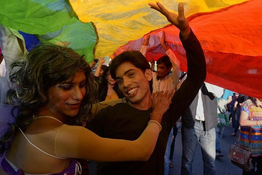 Indian members and supporters of the lesbian, gay, bisexual, transgender (LGBT) community dance during a Gay Pride Parade in New Delhi on Nov 30,2014.&nbsp;Hundreds of gays and lesbians marched through the streets of the Indian capital on Sunday, the