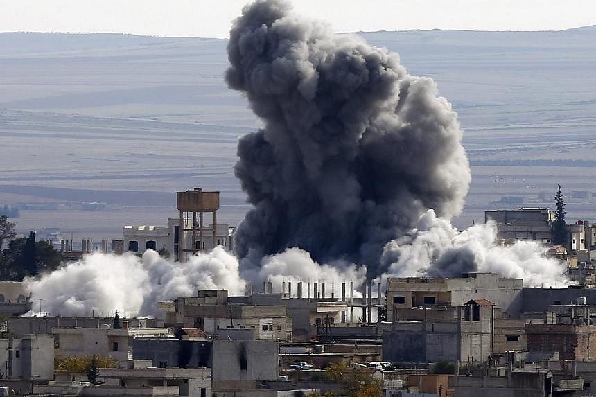 An explosion following an air strike is seen in western Kobane neighbourhood, on Nov 23, 2014.&nbsp;At least 50 extremists of the Islamic State in Iraq and Syria (ISIS) have been killed in the past 24 hours in clashes, suicide bombings and US-led air