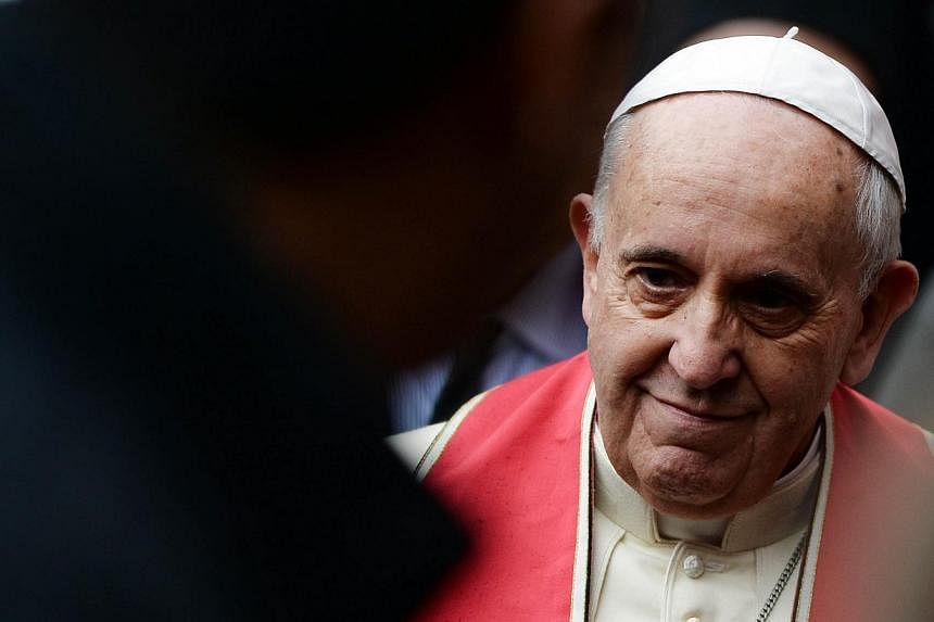 Pope Francis said hardline militants were carrying out a "profoundly grave sin against God" in Syria and Iraq, calling on Sunday for inter-religious dialogue and action against poverty to help end conflicts there. -- PHOTO: AFP