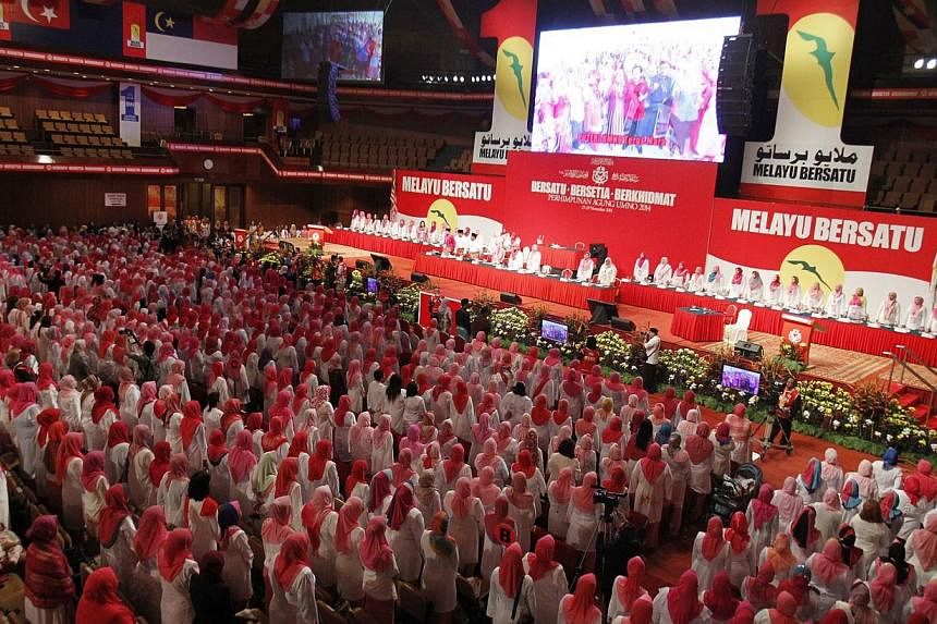 Delegates at Malaysia's Umno general assembly in Kuala Lumpur watched in pin-drop silence as a short video clip of a beheading by Islamic State in Iraq and Syria (ISIS) militants was aired.&nbsp;-- PHOTO:&nbsp;SIN CHEW DAILY PUBLICATION