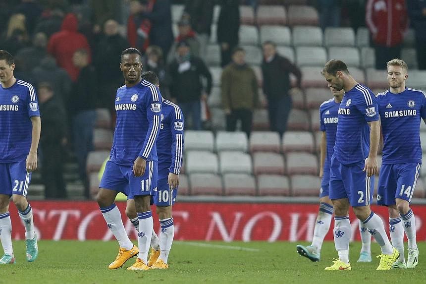 Chelsea players walking off the pitch after a frustrating 0-0 draw with Sunderland at the Stadium of Light on Nov 29, 2014. -- PHOTO: REUTERS