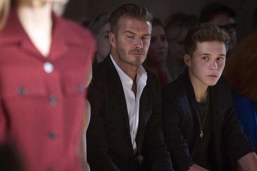 Retired English football star David Beckham and his teenage son Brooklyn were involved in a car crash outside Arsenal's training ground in Hertfordshire, north of London, but did not suffer any injuries, according to a source close to Beckham. -- PHO
