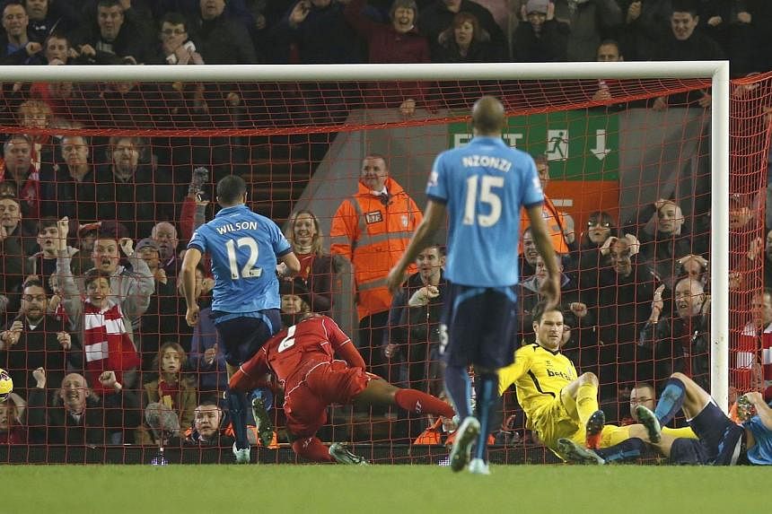 Liverpool's Glen Johnson (second left) scores a goal against Stoke City during their English Premier League soccer match at Anfield in Liverpool, northern England Nov 29, 2014. -- PHOTO: REUTERS