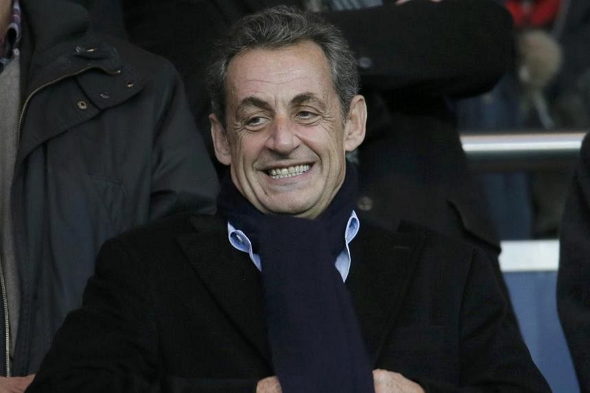 Former French president Nicolas Sarkozy attends the French Ligue 1 soccer match between Paris St Germain and Nice at the Parc des Princes Stadium in Paris Nov 29, 2014. Bruised by a humiliating election loss and ensnared in a tangle of legal woes, wh