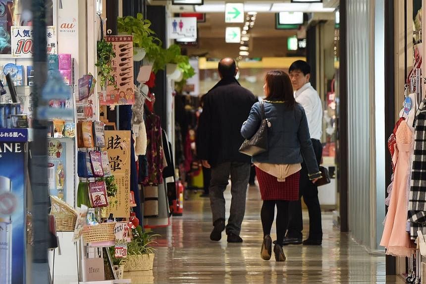 People strolling in a shopping mall in Tokyo. Japan's fall into recession between July-September could turn out to be less severe than feared, with new capital expenditure figures out on Monday suggesting revisions will put third quarter economic gro