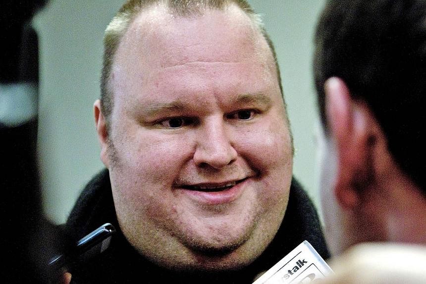 A file photo taken on July 3, 2013, shows Megaupload founder Kim Dotcom speaking to the media in Wellington.&nbsp;United States authorities have lost a motion to have cyber fugitive Kim Dotcom remanded in custody in New Zealand before his extradition