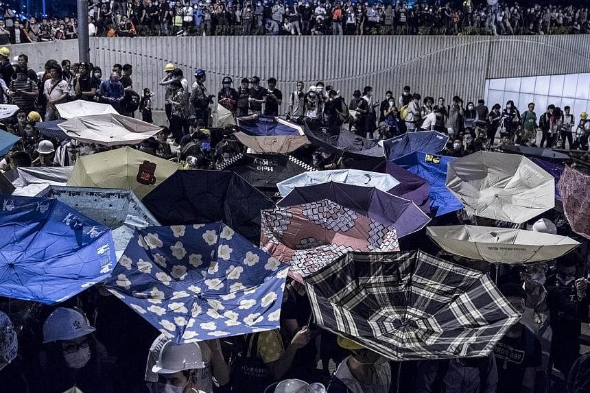 Pro-democracy protesters gather at Tamar, near the government headquarters in the Admiralty district of Hong Kong on Dec 1, 2014.&nbsp;Hong Kong's pro-democracy protests are now into the third month. With frustrations mounting, Chief Executive Leung 