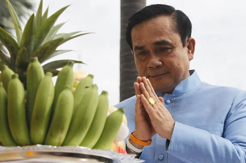 Thailand Prime Minister Prayuth Chan-O-Cha held talks with his Malaysian counterpart Najib Razak on Monday during which they were expected to discuss the deadly Muslim insurgency in southern Thailand along their shared border. -- PHOTO: REUTERS