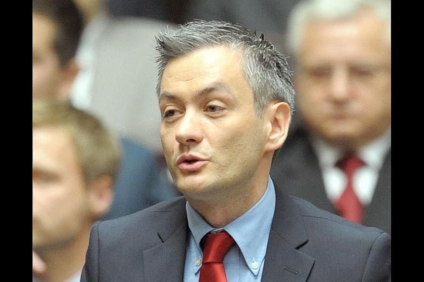 Poland's first openly gay lawmaker, Robert Biedron, in a photo taken on Nov 8,2011 during a session of the Polish Parliament in Warsaw. On Sunday, Polish voters elected him their first openly gay mayor as the heavily Catholic country gradually shifts