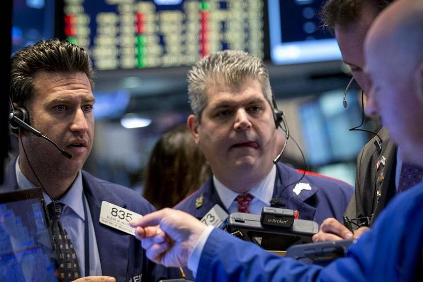Traders on the floor of the New York Stock Exchange on Dec 1, 2014. US stocks fell on Monday, with consumer counters pressured as Thanksgiving weekend in-store sales failed to impress. -- PHOTO: REUTERS
