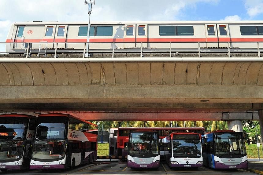 SMRT train services will start earlier on Sunday for people heading to the Standard Chartered Marathon 2014, while 12 bus services will be diverted between 1am and 3.30pm, SMRT said on Tuesday. -- PHOTO: ST FILE