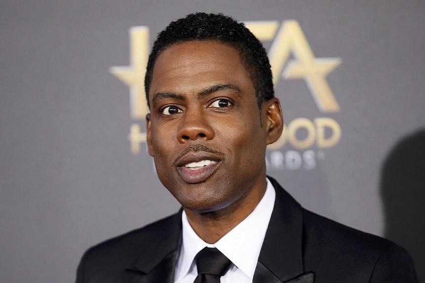 Comedian Chris Rock has made wide-ranging comments on current affairs in America, which people have been lapping up, during interviews promoting his new film Top Five. -- PHOTO: REUTERS